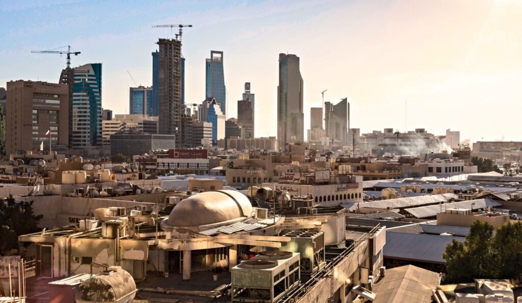 Riyadh skyline with modern skyscrapers and construction cranes at dusk